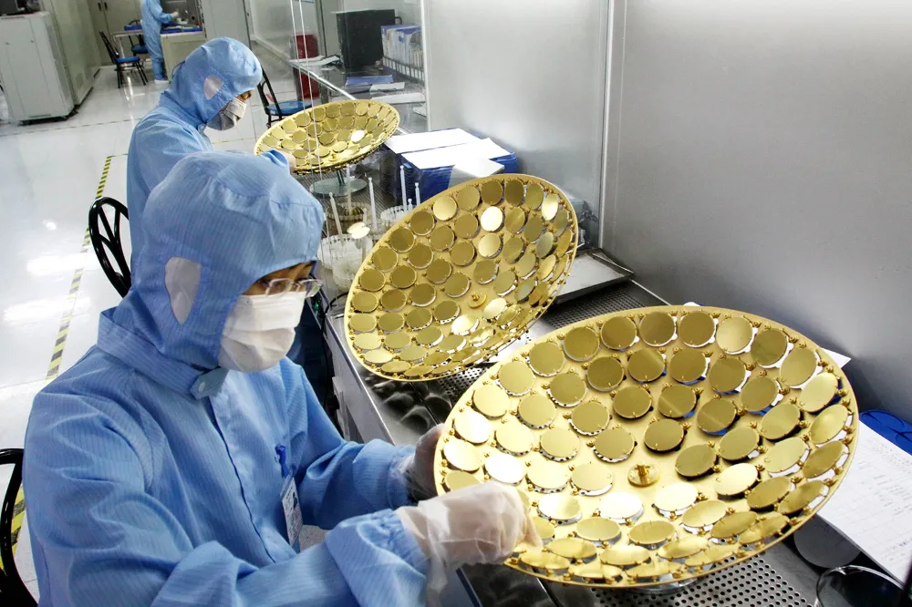Workers manufacture LED chips at a plant in Weifang, China, on June 27, 2011. To wean itself from foreign chip makers, the country in 2014 announced a plan to turn itself into a semiconductor-making powerhouse by 2030. REUTERS