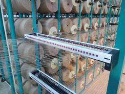 حلقه بوبین برای ماشین های نساجی و دریچه فعال برای تنظیم چنین حلقه بوبین